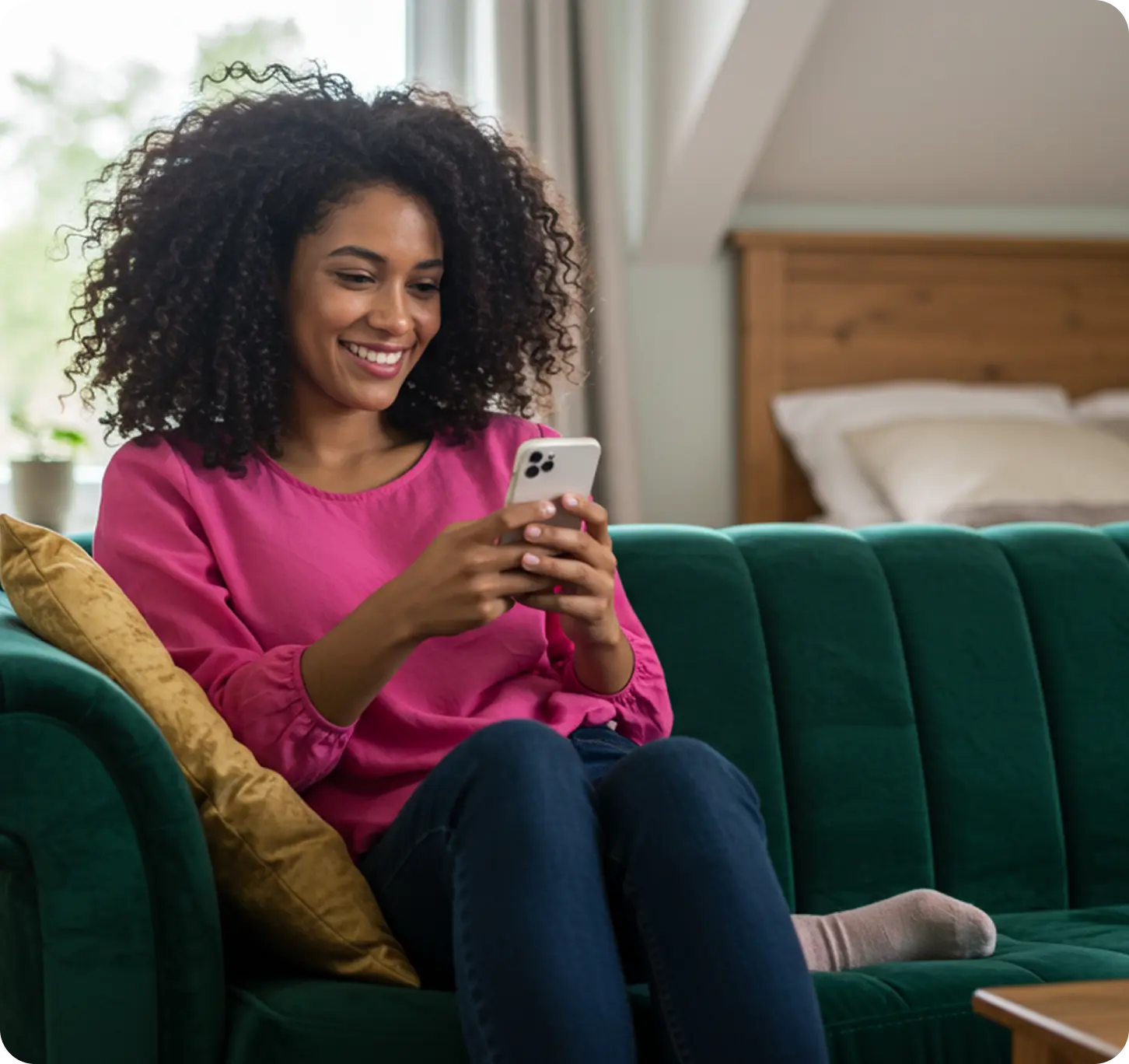 Woman using phone on couch